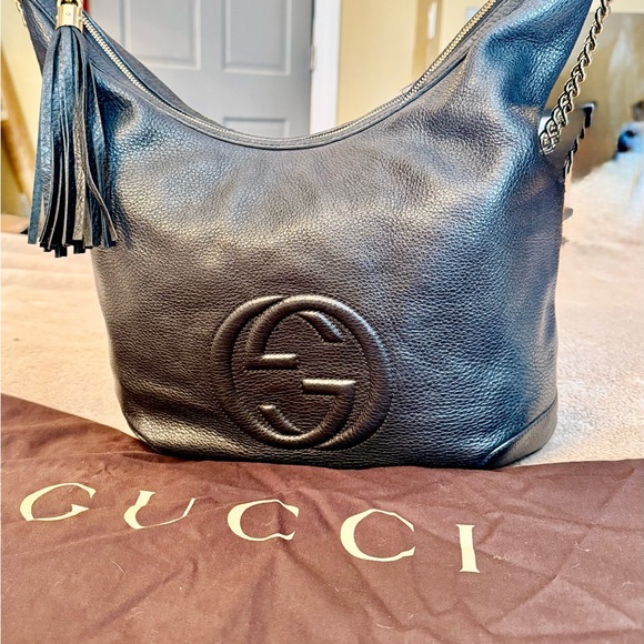 Gucci Black Hobo Bag with Embossed Logo and Tassel - Picture 1 of 8